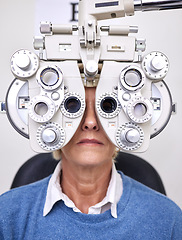 Image showing Senior woman patient, eye test and phoropter in hospital, optometrist office or clinic for vision healthcare. Optician tools, elderly lady or medical lens device for customer, client or consumer eyes