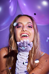 Image showing Beauty, confetti and portrait of a happy woman in a studio with balloons for a birthday celebration. Happiness, cosmetic and female model blowing a kiss with makeup by purple background and aesthetic