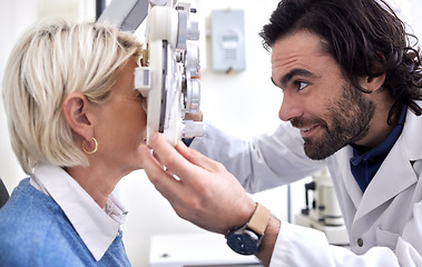 Image showing Doctor with woman in a vision test or eye exam for eyesight by doctor, optometrist or ophthalmologist with medical aid. Mature patient or client with a helpful optician to see or check glaucoma