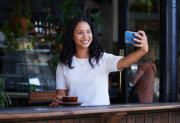 Image showing Woman at cafe, smile in selfie with smartphone, social media post with lifestyle or food influencer with coffee. Tech, phone photography and happy in picture, brand promotion for online community