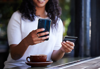 Image showing Woman, hands and phone with credit card for online shopping, ecommerce or purchase at coffee shop. Hand of female customer on smartphone for internet banking, app or wireless transaction at cafe