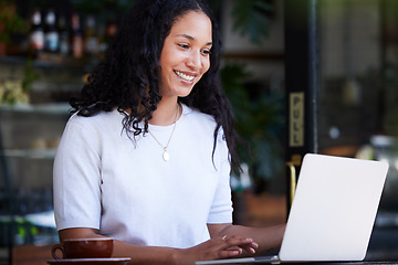 Image showing Woman, laptop and cafe for remote work, writing and tea break against a blurred background. Freelance, journalist and black female working on article, online project or creative idea in coffee shop