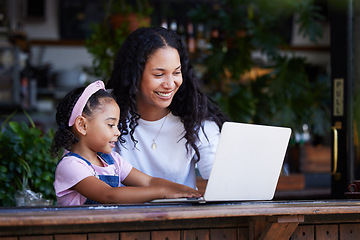 Image showing Mother, learning and girl with laptop at cafe for education and development online. Family, remote worker and happy woman teaching kid how to type on computer at restaurant, bonding and having fun.