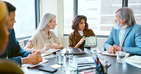 Image showing Business people, tablet and teamwork for planning, strategy and ideas by desk in modern office for goal. Corporate group, digital tech and finance team for brainstorming, vision or target in New York