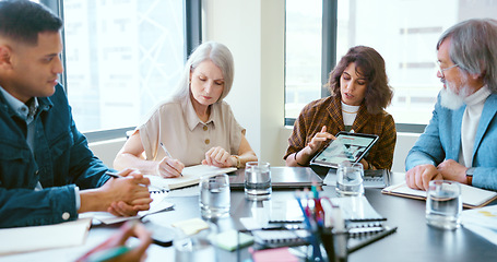 Image showing Business people, tablet and teamwork for planning, strategy and ideas by desk in modern office for goal. Corporate group, digital tech and finance team for brainstorming, vision or target in New York