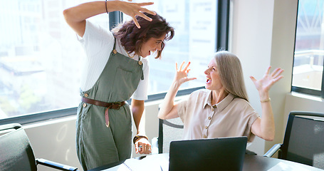 Image showing Success, handshake and business women with a laptop, celebrate win and email motivation. Fist bump, teamwork and excited employees reading communication on a computer with a partnership celebration