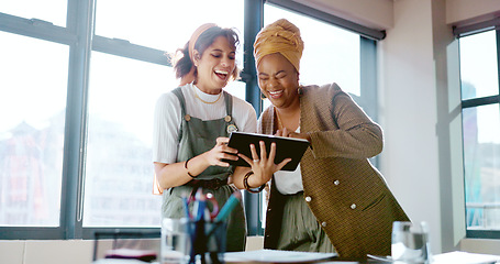 Image showing Digital tablet, women and marketing team doing creative research for a project in their office. Collaboration, teamwork and female business partners checking their company website on a mobile device.