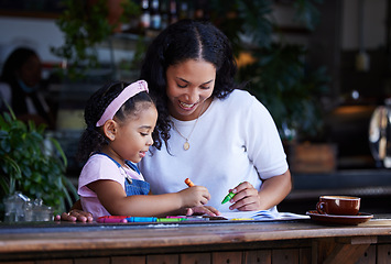 Image showing Learning, drawing and mother with girl at cafe with books, studying and art education. Family, love and mama teaching kid how to color with crayons, having fun and bonding together in restaurant shop