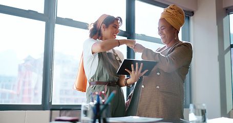 Image showing Digital tablet, women and marketing team doing creative research for a project in their office. Collaboration, teamwork and female business partners checking their company website on a mobile device.