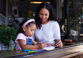 Image showing Art, drawing and mother and child at a restaurant with an activity, creativity and color on paper. Creative, happy and girl learning to draw with her mom while eating at a cafe and waiting for food