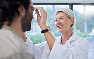 Image showing Optometrist, woman and helping customer, eye and glasses in store for vision, eyesight or lenses. Face of happy optician, new frames and consulting services in retail shop, analysis and clinic choice