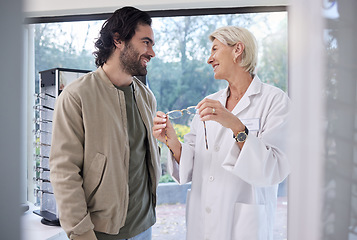 Image showing Woman optometrist help man with glasses in optometry store, retail shopping and vision services. Optician, eye care and choice of frames, lenses and happy customer consulting, health or wellness test