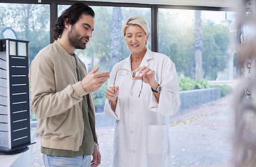 Image showing Woman, optician and help man with glasses, optometry and retail shopping for vision services. Optometrist, eye care and choice of frames, lenses and happy customer consulting, health or wellness test