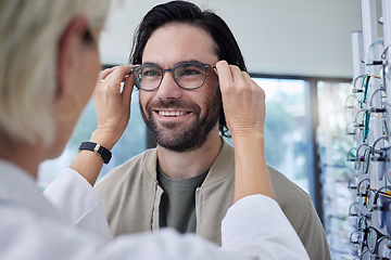 Image showing Optician, glasses and happy man in store for vision, eyesight and choice of frames. Customer face, optometrist and lenses for eye care test, healthcare consulting or retail shop services for wellness