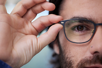 Image showing Glasses, optometry and eye of man fitting prescription eyewear, spectacles and holding specs. Half, face and portrait of male person with new stylish frame for vision from optometrist or optician