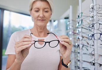 Image showing Woman customer, glasses and eye care shopping for lens or frame for vision wellness with optometry. Happy senior person with choice or decision for retail sale with health insurance at optics store