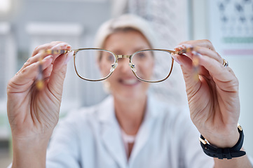 Image showing Optometry person putting glasses on in client face pov for consultation, frame check and vision test in store. Customer services, help and support of professional worker or person lens eyes care