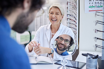 Image showing Mirror, glasses or happy man consulting a doctor for professional eyesight advice with at a retail store. Customer checking to see vision health with a trusted senior optician or ophthalmologist