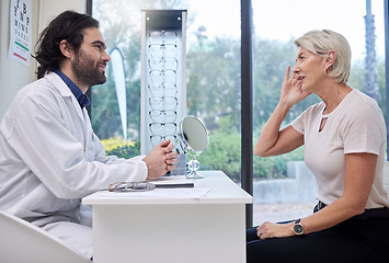 Image showing Eye doctor, senior or woman consulting for eyesight advice at optometrist or ophthalmologist with medical aid. Customer talking or asking questions to check vision health with a trusted optician