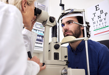 Image showing Eye exam, vision test and patient with laser lens and doctor at optometry consultation. Face of a man and woman healthcare person with machine for eyes, wellness and health insurance with expert care