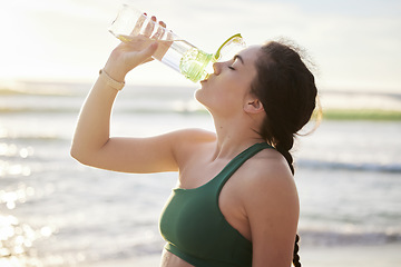 Image showing Drinking water, beach and woman in fitness training, exercise or outdoor workout with nutrition, health and wellness. Liquid bottle for diet, goals and or cardio of runner, athlete or person by sea