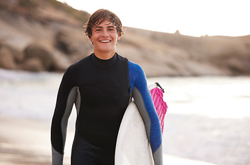 Image showing Fitness, surfing and portrait of a man at the beach for water sports, happiness and holiday in Bali. Smile, training and surfer with a board for exercise, ocean break and activity on a vacation