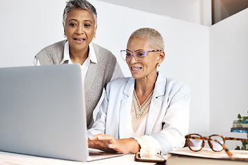 Image showing Laptop, teamwork and support with a woman manager training an employee in the office at work. Computer, collaboration and help with a female coach or supervisor at an employee desk for assistance