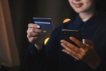 Image showing Business, bank and hands with credit card and phone in office at night for virtual purchase, payment and sale. Ecommerce, technology and woman with smartphone for internet banking or online shopping