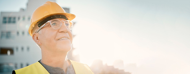Image showing Senior man, builder and construction in the city with smile and helmet for safety or security at site on mockup. Elderly male contractor, engineer or technician face smiling with hard hat in town