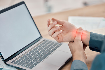 Image showing Laptop, office and business woman with wrist pain, injury or accident while working on a project. Stress, medical emergency and professional female with a sprain muscle on a computer in the workplace