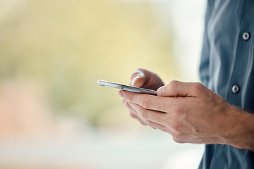 Image showing Man hands, phone and mobile networking of a businessman in a office on web. Online communication, text writing and technology of a social media writer employee with mock up and blurred background