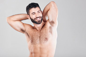 Image showing Fitness, body and man with muscles in a studio after a bodybuilding workout or sport training. Health, wellness and muscular male model flexing his biceps while posing isolated by a gray background.