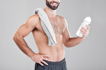 Image showing Fitness, exercise and man with water bottle, towel and workout for wellness, healthy lifestyle and grey studio background. Male, athlete or liquid for after training, practice or endurance for energy