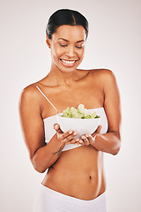 Image showing Health, smile or woman with grapes in a studio for a healthy snack, nutrition diet or heart benefits. Body goals, lose weight or happy young female model eating fruits isolated by a white background