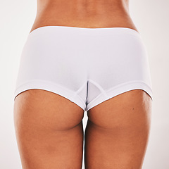 Image showing Buttocks, underwear and closeup with a model black woman in studio on a gray background from the back. Skin, real and bum in panties with a normal female posing to promote natural body positivity