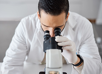 Image showing Science, microscope and a doctor man at work in a laboratory for innovation or research. Medical, analytics and biotechnology with a male scientist working in a lab for breakthrough
