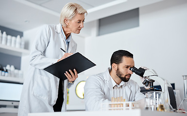 Image showing Scientist man, woman and microscope with checklist in laboratory for research at pharma company. Science team, data analytics and biotechnology for goals, vision and study virus with teamwork in lab