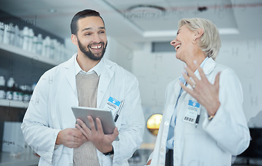 Image showing Science, tablet and scientists talking in a lab working on scientific research, experiment or test. Happy, funny and professional researchers laughing in discussion with mobile device in a laboratory