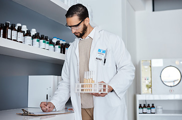 Image showing Science, writing and man with test tube in laboratory with clipboard for results, medical report and research. Pharmaceutical, health and scientist write notes for liquid sample, medicine and vaccine