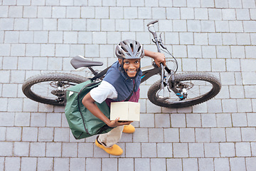 Image showing Bicycle, delivery and black man with courier services, package and ecommerce transport in portrait above. Box, logistics and carbon footprint driver with stock product, business and career bike