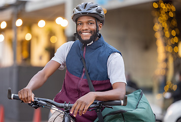 Image showing Black man, bicycle and portrait smile in the city for travel, trip or delivery with bag outdoors. Happy African American male on bike smiling for traveling, adventure or transport in an urban town