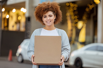 Image showing Moving box, black woman and happiness outdoor by new home apartment building with a smile. Real estate, investment and young person holding boxes feeling happy about mortgage and property sale