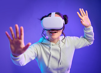 Image showing Woman in metaverse with virtual reality glasses for futuristic gaming, cyber and 3d world. Excited gamer person with hand for wow ar, digital experience and creative cyberpunk purple background app