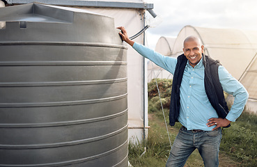 Image showing Farmer, portrait and water tank in farming liquid or soil hydration for vegetables, food or crops growth. Irrigation, storage and agriculture container for watering conservation, smile or happy man