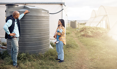 Image showing Water, tank and sustainable or sustainability advice by farmer to a mother for the environment on a farm. Saving, agriculture and eco friendly people talking about organic farming in the countryside