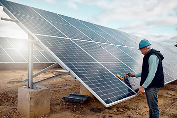 Image showing Renewable energy, solar panel and senior construction worker outdoor working on grid. Industrial engineer, sustainability and eco friendly development of a mature engineering employee and handyman