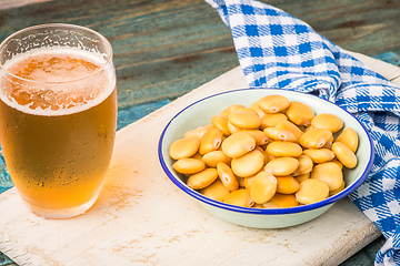 Image showing Tasty lupins and glass of beer