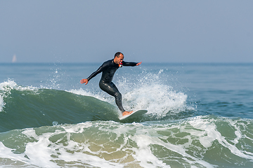 Image showing Surfing the waves