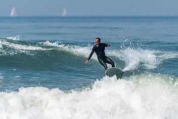 Image showing Surfing the waves