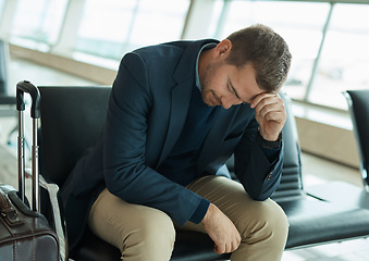 Image showing Airport, sad and headache of man waiting to travel, frustrated or depression in transport delay, crisis or problem. Immigration, stress and angry person depressed for flight fail or schedule mistake